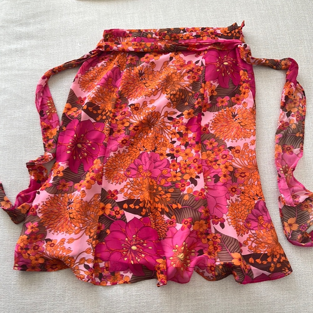 New skirt (washed but never worn). Polyester, light material.